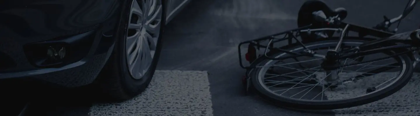 bike accident next to car