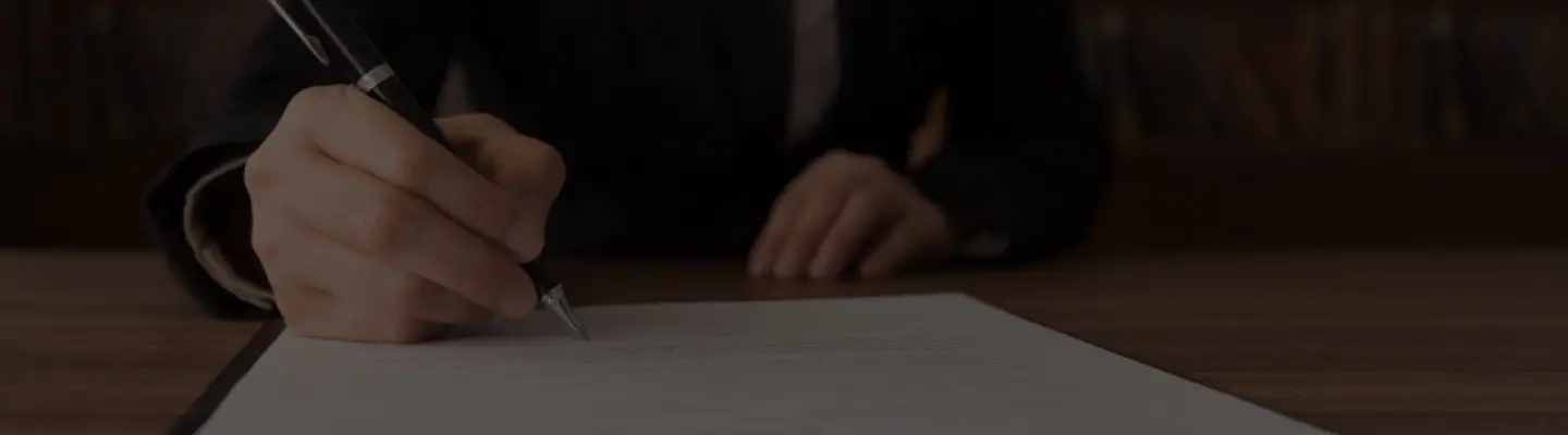 lawyer taking notes at a personal injury settlement meeting